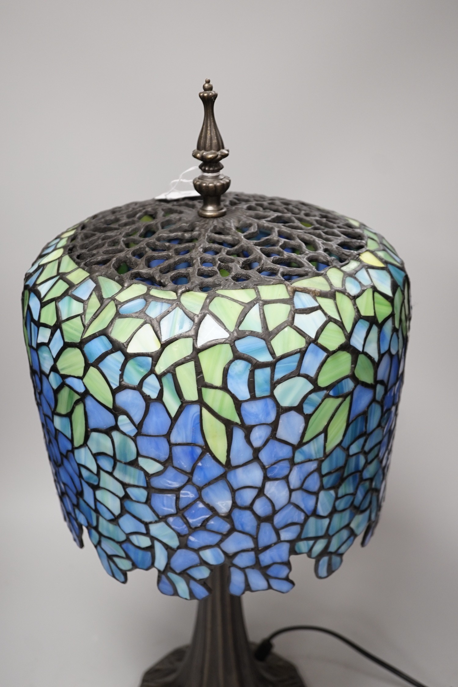 A Tiffany style stained glass lamp. 54cm tall